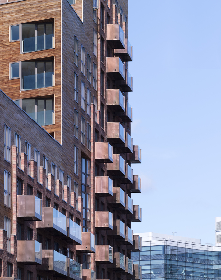 WATERMANS PLACE GRANARY WHARF LEEDS CZWG SOUTH ELEVATION DETAIL WITH COPPER BALCONIES AND TIMBER